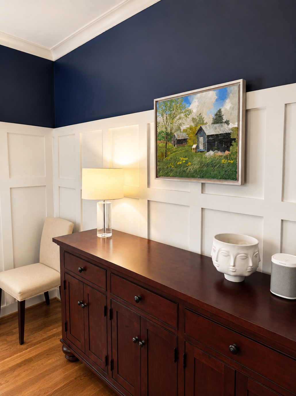 Interior detail with custom trim, wainscoting, and artwork